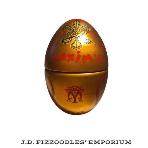 Maxim's of Paris Egg Shaped Tin orange